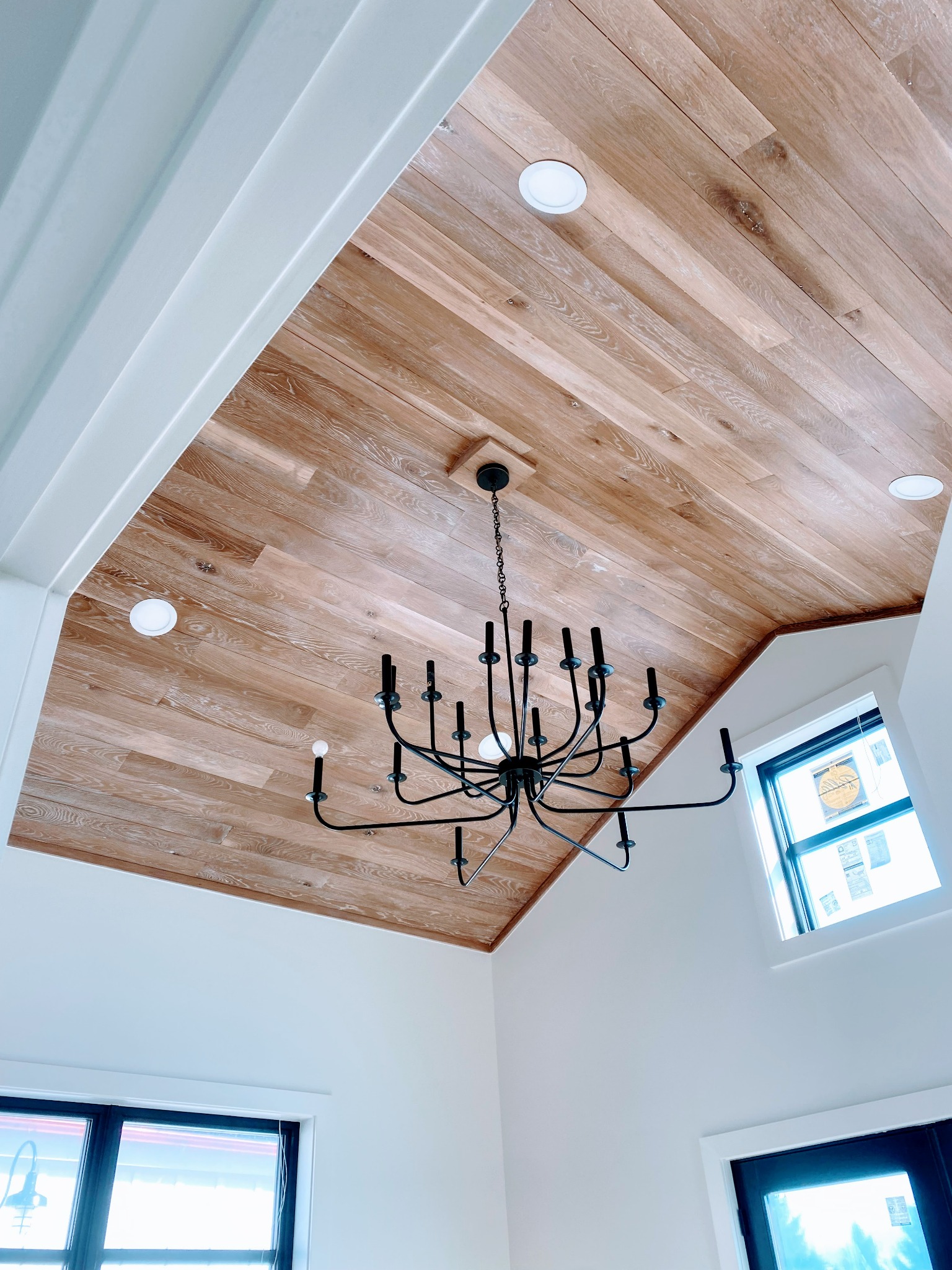 Residential space with wood ceiling and chandelier lighting