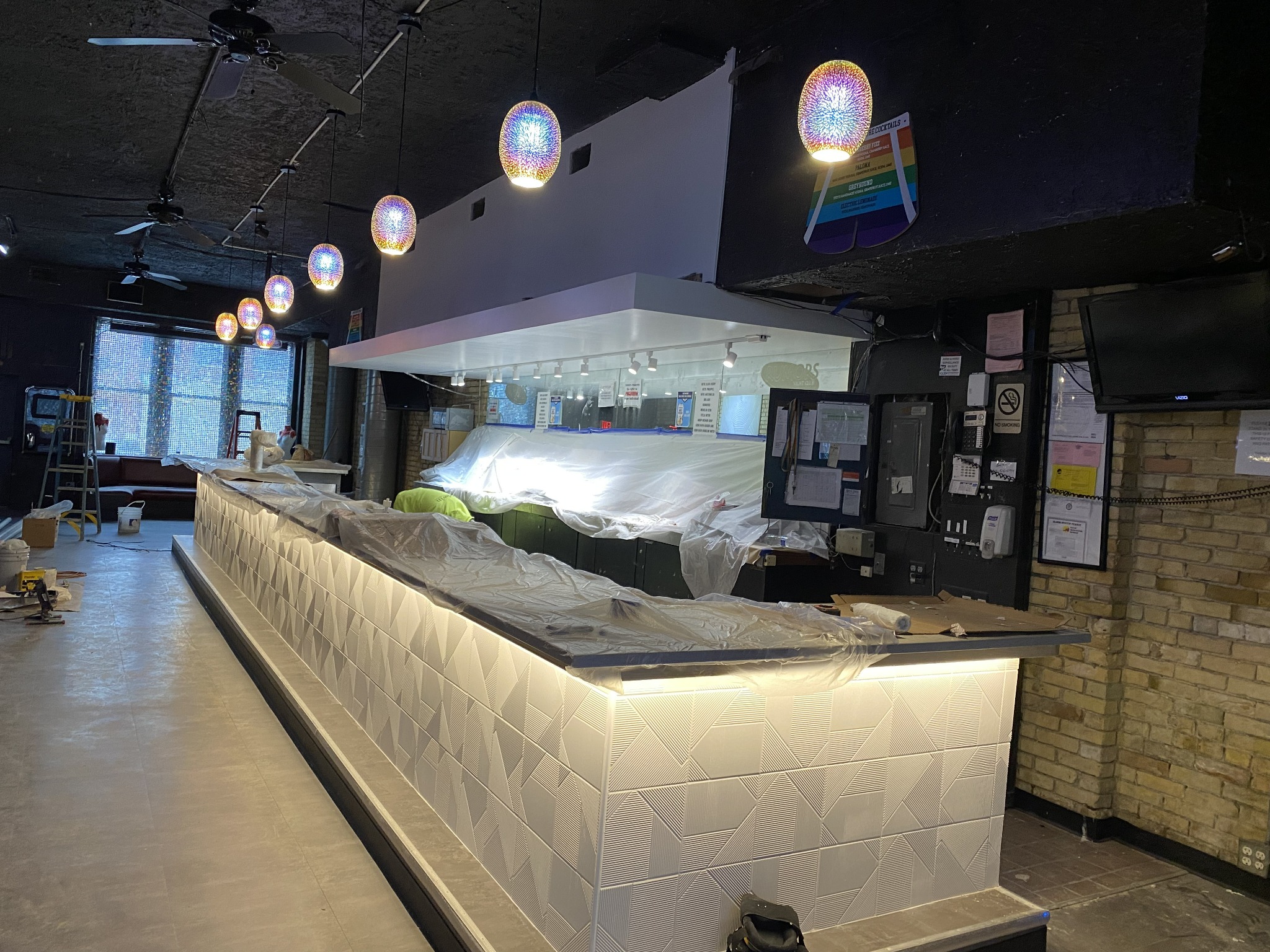 Commercial bar with colorful pendant lights installation