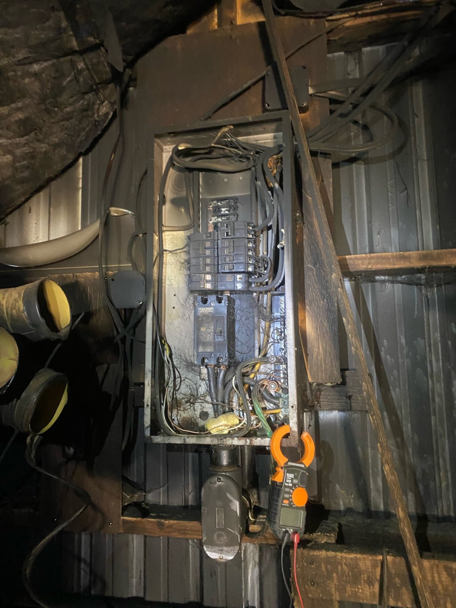 Electrical safety article thumbnail showing a fire-damaged electrical panel restoration