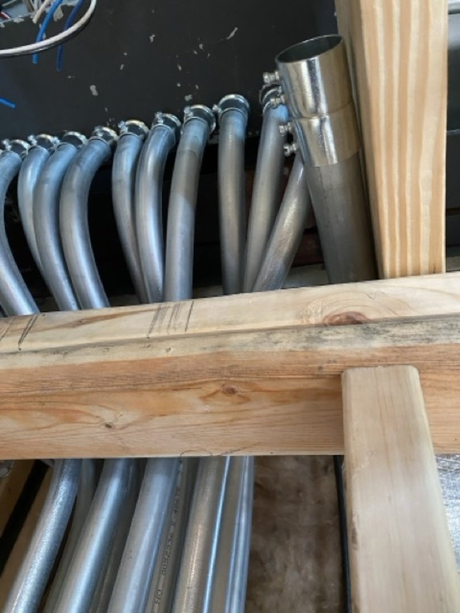 Curved conduits arranged through framing